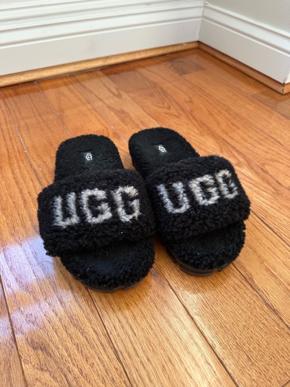 UGG Black Shearling Logo Slide Slippers with White Logo